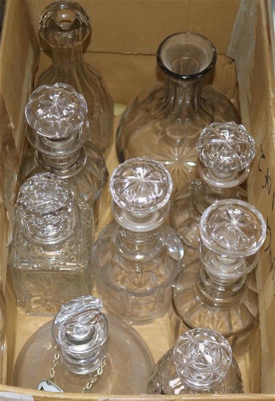Nine cut glass decanters